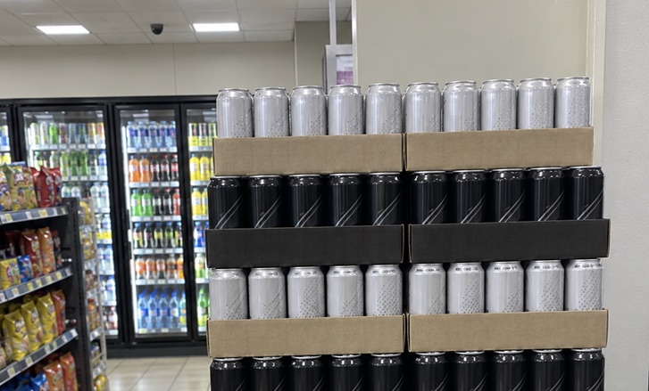 The finished Ridgeline endcap: stacked cases of cans on the sales floor